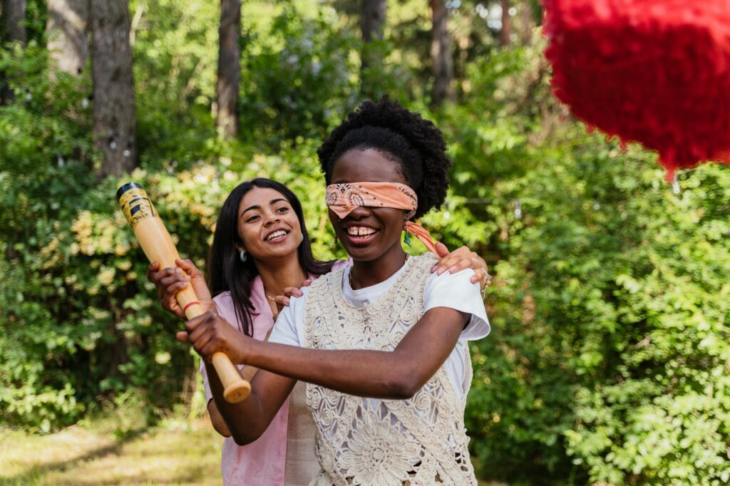 a woman blindfolded with handkerchief while playing